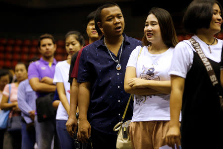 People line up to cast their early vote for the upcoming Thai election at a polling station in Bangkok, Thailand, March 17, 2019. REUTERS/Soe Zeya Tun