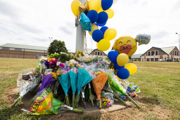 A memorial of flowers and balloons in front of Apalachee High School in Winder, Georgia.