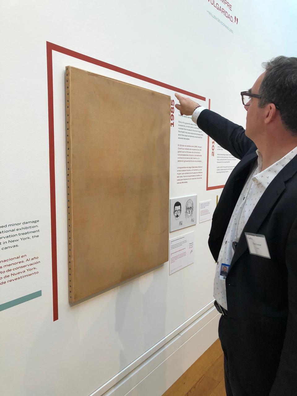 Tom Learner, head of science at the Getty Conservation Institute, shows where "Woman-Ochre" was cut from its frame. The cut failed to go through a secondary canvas.