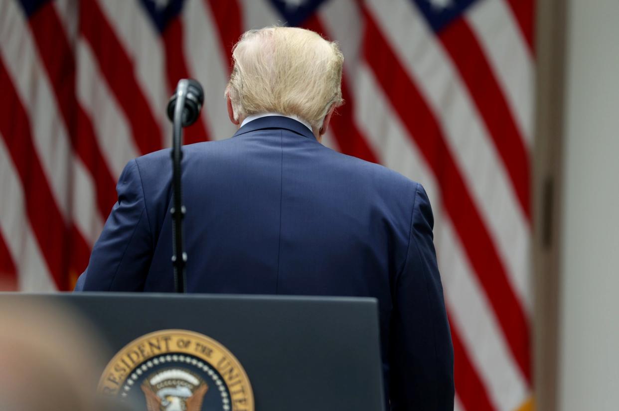 Donald Trump walks away from a lectern in the Rose Garden of the White House after making a statement on China and the World Health Organisation: REUTERS