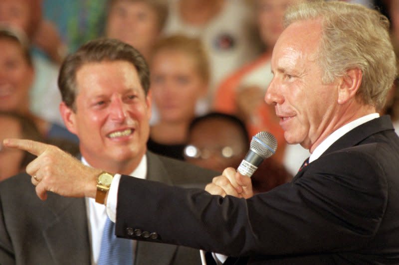 Vice President and Democratic presidential candidate Albert "Al" Gore (left) looks on as his vice-presidential running mate Sen. Joseph "Joe" Lieberman (D-Connecticut) addresses a crowd of about 150 of Gore's "friends and neighbors" during a town hall reunion on Aug. 9, 2000 in Gore's hometown of Carthage, Tennessee. The reunion was the start of the duo's pre-convention Going the Distance Tour. File Photo by Billy Suratt/UPI