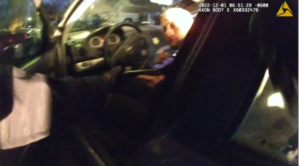 A report released by Shawnee County District Attorney Mike Kagay's office included this body camera image of Dylan Walstrom holding a handgun Dec. 1 while sitting in the front seat of a stolen car and turning toward an approaching Topeka police officer.