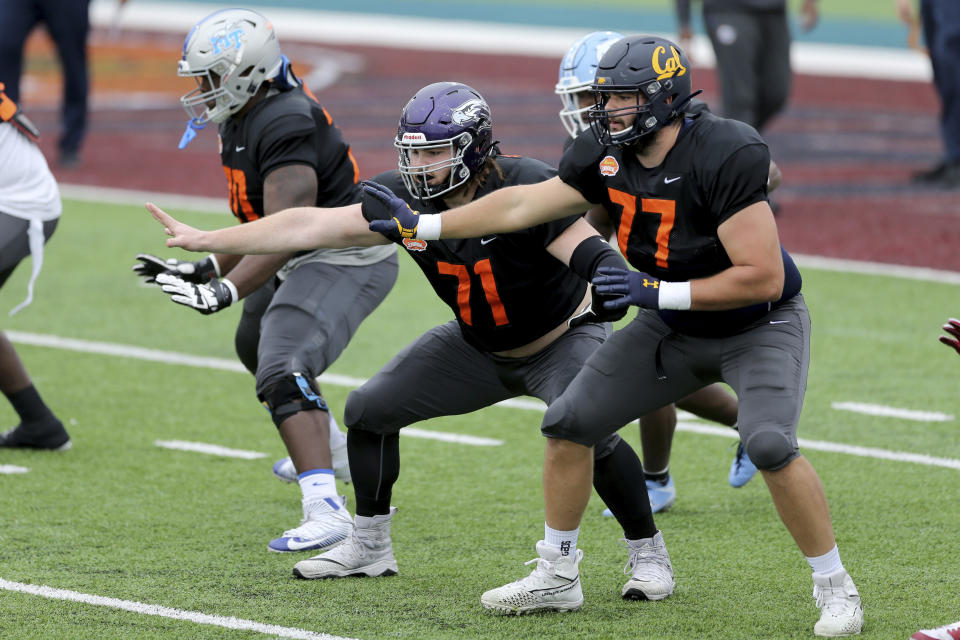 National Team offensive lineman Quinn Meinerz (71), center, of Wisconsin–Whitewater is making a name for himself at the 2021 Senior Bowl. (AP Photo/Rusty Costanza)