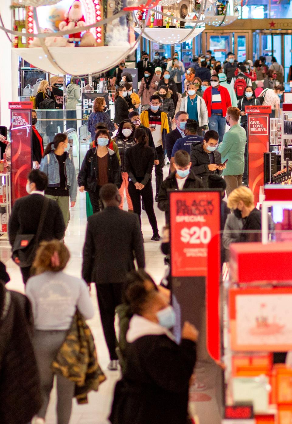 Customers shop at Macys department store in New York on Black FridayAFP via Getty Images