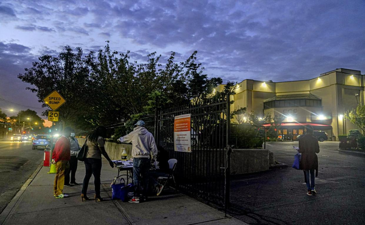 <span class="caption">Volunteers outside the Christian Cultural Center in New York register new voters as part of the 'Souls to the Polls' initiative.</span> <span class="attribution"><a class="link " href="https://newsroom.ap.org/detail/Election2020SoulstothePolls/023b22e0b56c452ca4e2fd9e08e964da/photo?Query=black%20church%20voting&mediaType=photo,video,graphic&sortBy=arrivaldatetime:desc&dateRange=Anytime&totalCount=75&currentItemNo=7" rel="nofollow noopener" target="_blank" data-ylk="slk:AP Photo/Bebeto Matthews;elm:context_link;itc:0;sec:content-canvas">AP Photo/Bebeto Matthews</a></span>