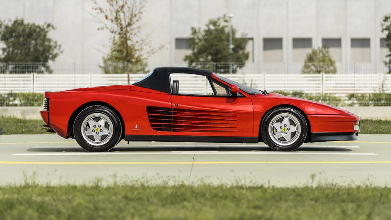 Profile view with closed top of red Ferrari Testarossa Pininfarina Spider "Special Production"