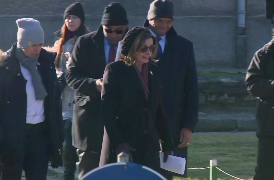 U.S. House Speaker Nancy Pelosi, centre, and a Congressional delegation during a visit to the former Nazi death camp of Auschwitz-Birkenau, Poland, Tuesday Jan. 21, 2020. At the memorial site in southern Poland, Pelosi laid a wreath at the Auschwitz Death Wall where inmates were executed, ahead of the upcoming 75th anniversary of its liberation by Soviet troops. (TVN via AP)