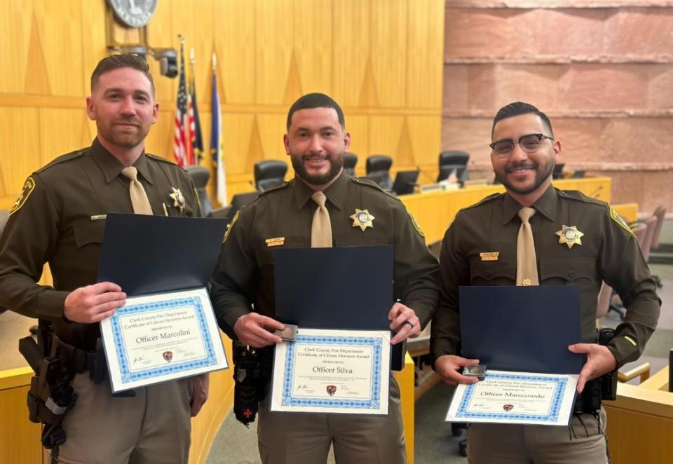 <em>Three Las Vegas Metropolitan police officers were honored on Wednesday for their quick action to save a woman from a building fire in December 2023. (LVMPD)</em>