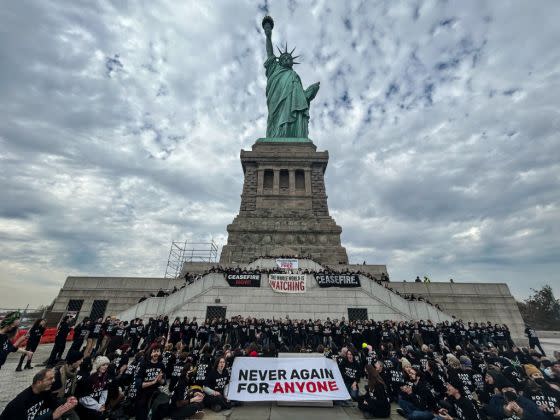 Activists from Jewish Voice for Peace activists occupy the pedestal of the Statue of Liberty on November 6, 2023 in New York City. <span class="copyright">Stephanie Keith—Getty Images</span>