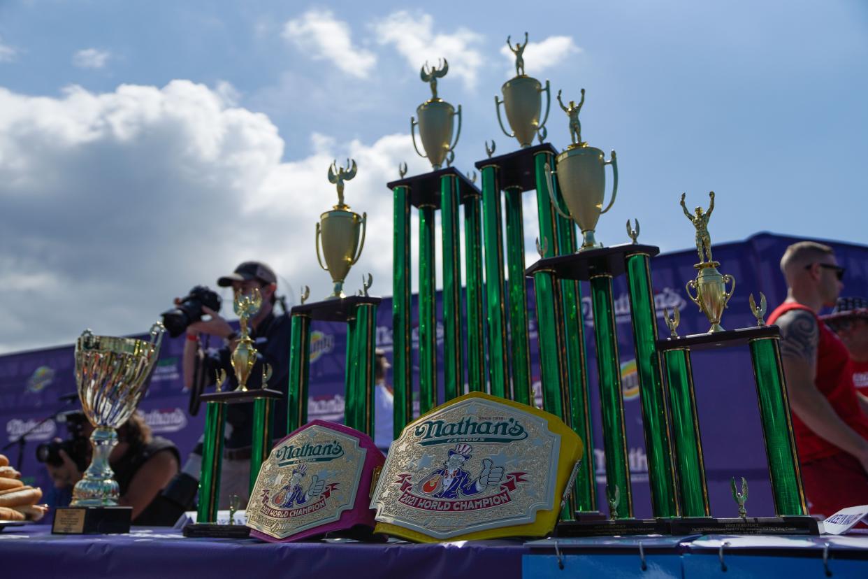 Trophies and belts for the contestants of the 2021 Nathans Famous 4th Of July International Hot Dog Eating Contest sit on a table on July 4, 2021, in New York City.