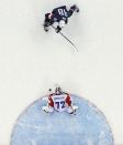 Russia goaltender Sergei Bobrovski stops a break away from USA forward Patrick Kane in overtime of a men's ice hockey game at the 2014 Winter Olympics, Saturday, Feb. 15, 2014, in Sochi, Russia. (AP Photo/Julio Cortez )