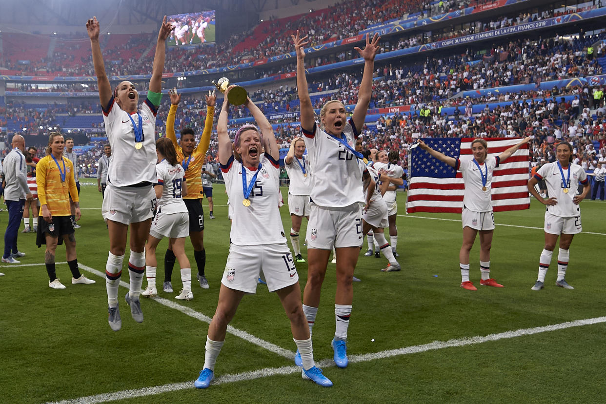 Megan Rapinoe (Reign FC) and Alex Morgan (Orlando Pride) of United States celebrate whit her teammates after winning the 2019 FIFA Women's World Cup France Final match between The United State of America and The Netherlands at Stade de Lyon on July 7, 2019 in Lyon, France. (Photo by Jose Breton/NurPhoto via Getty Images)