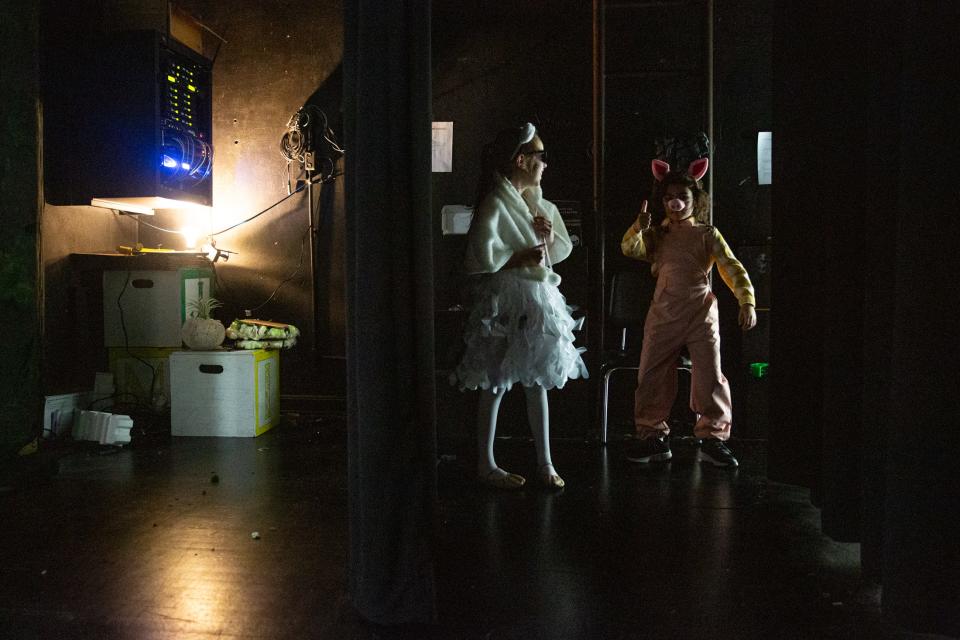 Fourth grade students Kylee Milner and Liam Stewart wait for their turn during mic checks during Shrek Jr. dress rehearsals at Metro Elementary on Thursday, March, 21, 2024, in Corpus Christi, Texas.