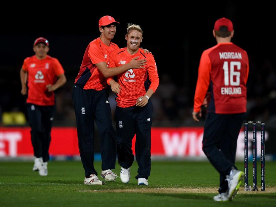 Matt Parkinson and Pat Brown celebrate the dismissal of Daryl Mitchell: Getty