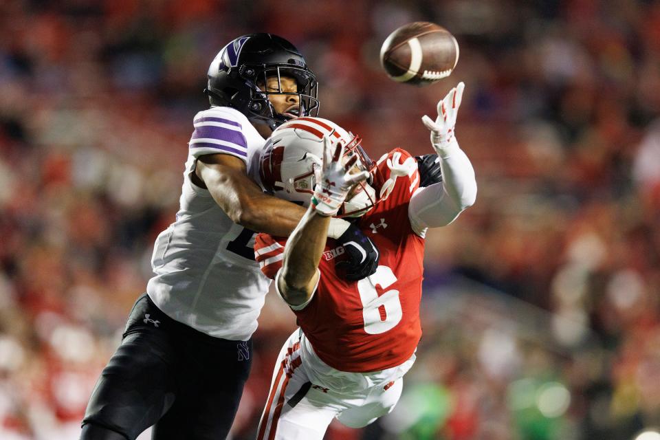 Nov 11, 2023; Madison, Wisconsin, USA; Northwestern Wildcats defensive back Rod Heard II (24) defends the pass intended for Wisconsin Badgers wide receiver Will Pauling (6) during the fourth quarter at Camp Randall Stadium. Mandatory Credit: Jeff Hanisch-USA TODAY Sports