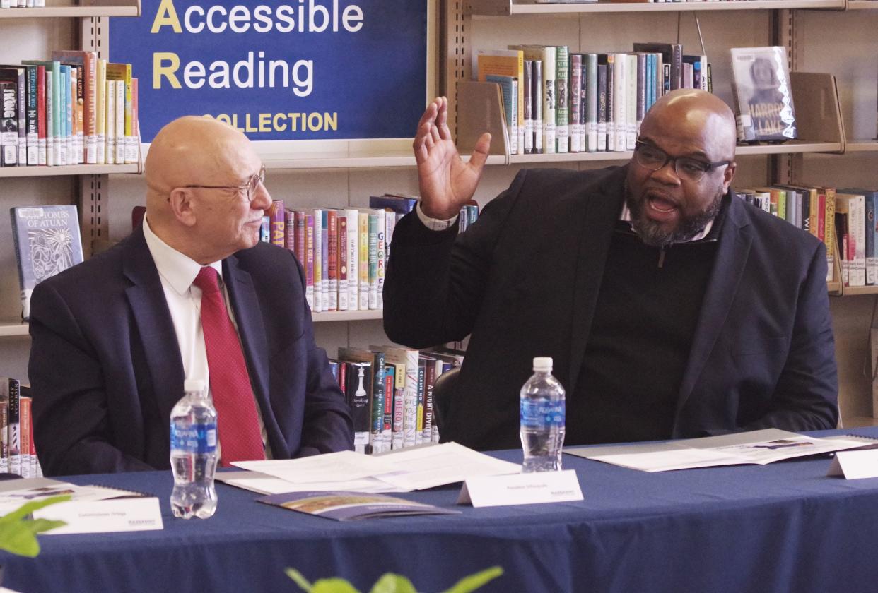 Massachusetts Secretary of Education Patrick Tutwiler, right, speaks at a Massasoit Community College roundtable on Thursday, March 9, 2023. To the left is Massasoit President Ray DiPasquale.