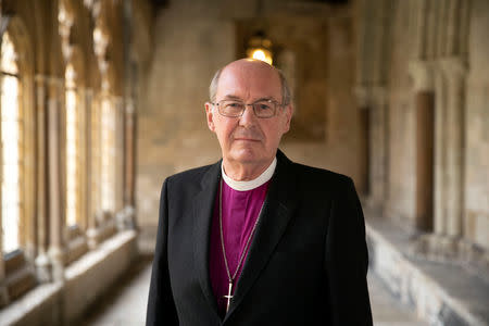 The Right Reverend David Conner, Dean of Windsor, who will conduct the wedding ceremony of Princess Eugenie and Jack Brooksbank, poses outside the chapel in Windsor, Britain, October 11, 2018. Steve Parsons/Pool via REUTERS