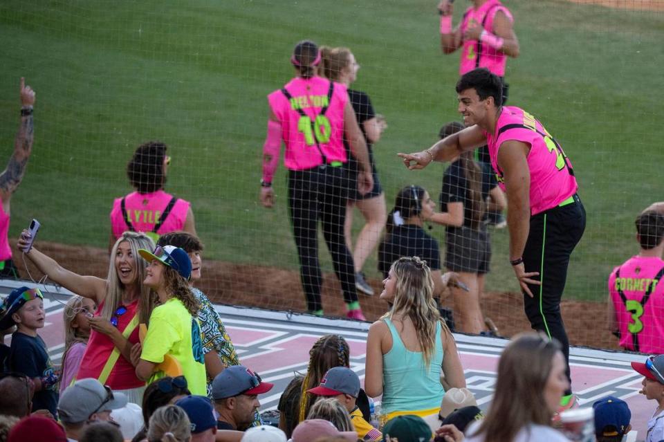 The Savanna Party Animals’ Jake Lialios (27) takes a selfie with fans during the Savannah Bananas World Tour on Saturday, July 29, 2023, at Sutter Health Park in West Sacramento.