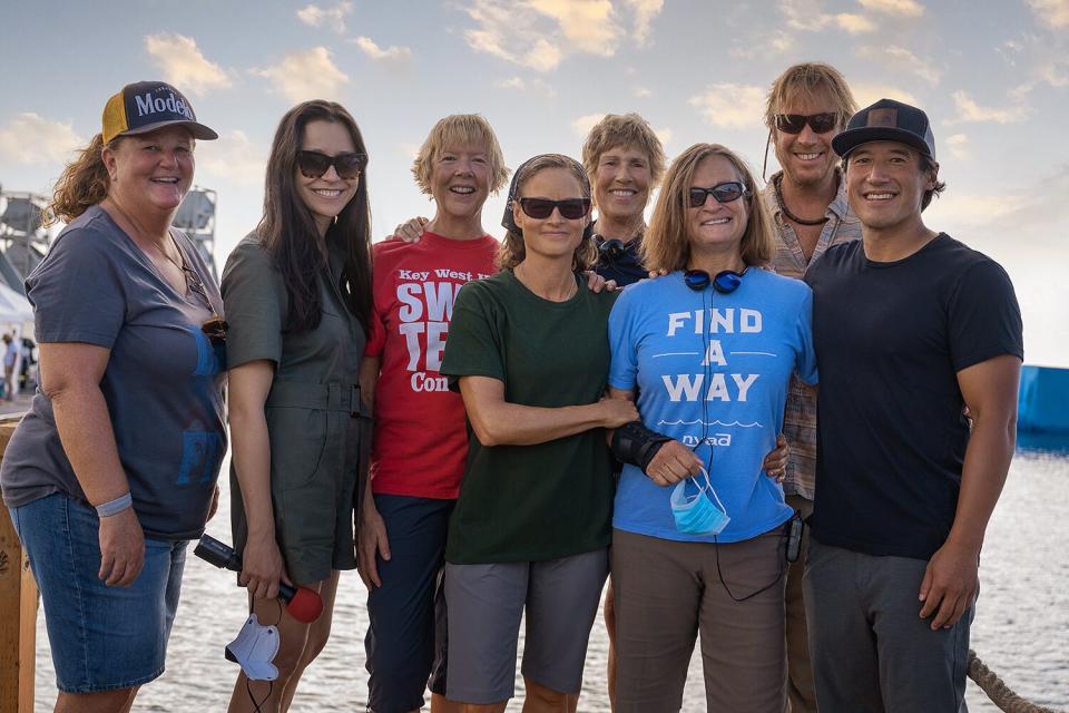 NYAD. (L-R) Karly Rothenberg as Dee, director Elizabeth Chai Vasarhelyi, Annette Bening as Diana Nyad, Jodie Foster as Bonnie Stoll, Diana Nyad, Bonnie Stoll, Rhys Ifans as John Bartlett and director Jimmy Chin on the set of NYAD.