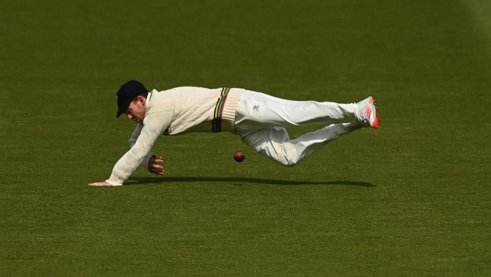 <p>LONDON, ENGLAND - MAY 06: Ryan Higgins of Gloucestershire stops the ball during day one of the LV= Insurance County Championship match between Middlesex and Gloucestershire at Lord's Cricket Ground on May 06, 2021 in London, England. Sporting stadiums around the UK remain under strict restrictions due to the Coronavirus Pandemic as Government social distancing laws prohibit fans inside venues resulting in games being played behind closed doors. (Photo by Philip Brown/Getty Images)</p>
