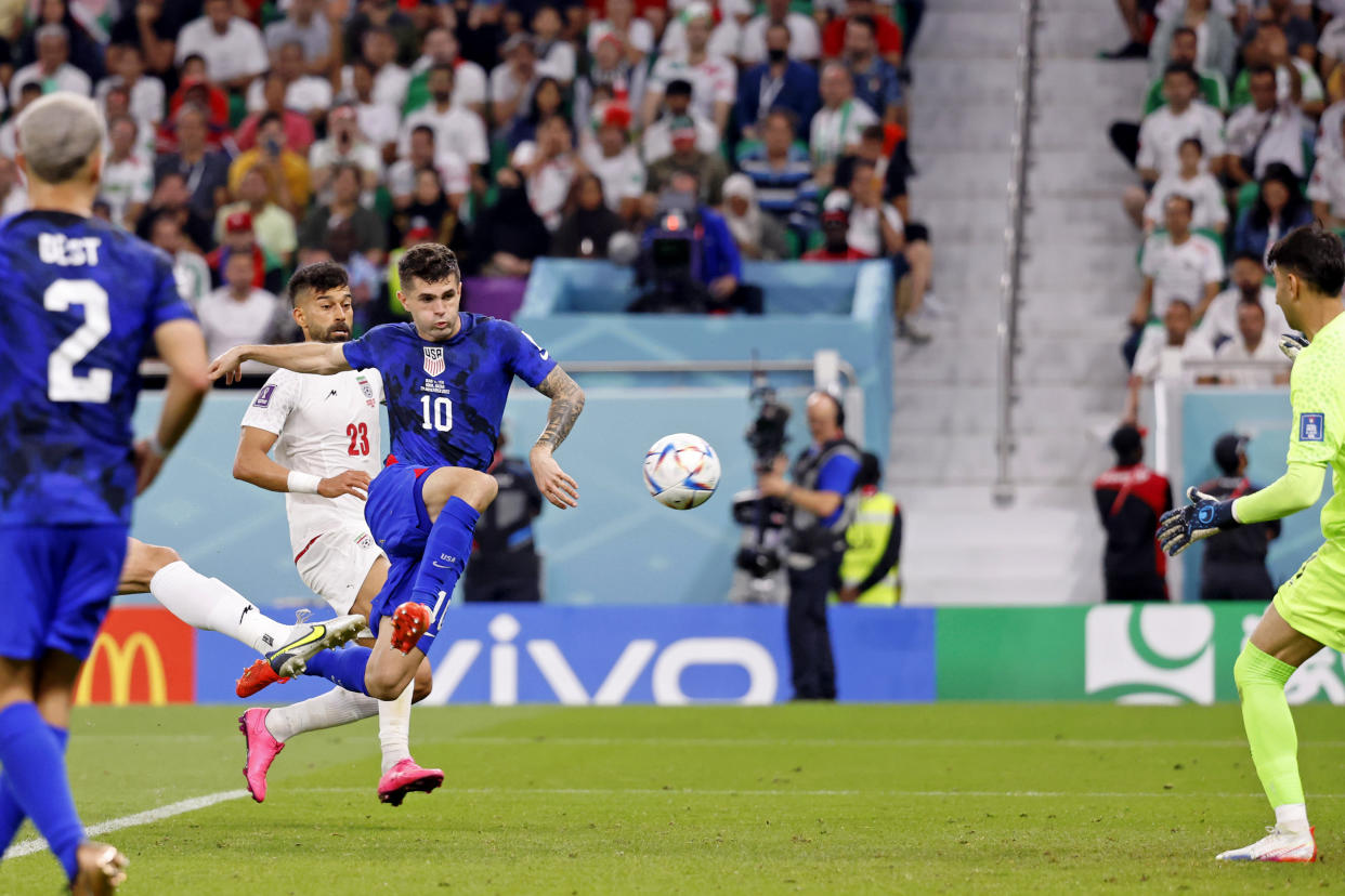 Nov 29, 2022; Doha, Qatar; United States of America forward Christian Pulisic (10) scores a goal against Iran during the first half of a group stage during the 2022 World Cup at Al Thumama Stadium. Mandatory Credit: Yukihito Taguchi-USA TODAY Sports