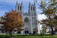 People gather before services on a glorious fall day at the National Cathedral in Washington, DC.