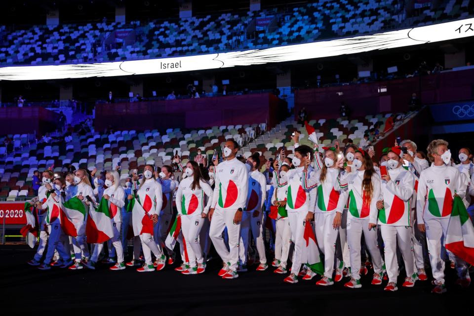 Team Italy enters Tokyo's Olympic Stadium for the opening ceremony.