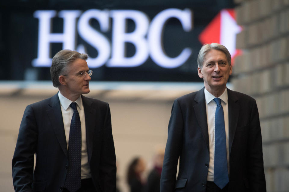 Outgoing HSBC CEO John Flint pictured with former UK Chancellor of the Exchequer Philip Hammond (R). Photo: STEFAN ROUSSEAU/AFP/Getty Images