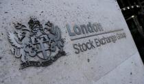 Signage is seen outside the entrance of the London Stock Exchange in London
