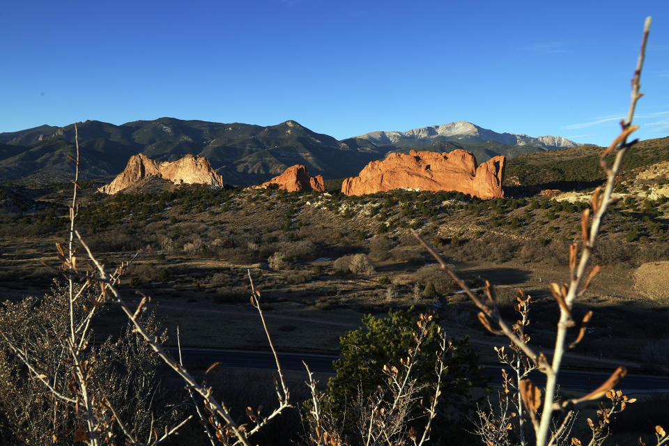 The Garden of the Gods is seen in morning light Wednesday, Nov. 23, 2022, in Colorado Springs, Colo. With a growing and diversifying population, the city nestled at the foothills of the Rockies is a patchwork of disparate social and cultural fabrics. But last weekend’s shooting has raised uneasy questions about the lasting legacy of cultural conflicts that caught fire decades ago and gave Colorado Springs a reputation as a cauldron of religion-infused conservatism, where LGBTQ people didn't fit in with the most vocal community leaders' idea of family values (AP Photo/Brittany Peterson)