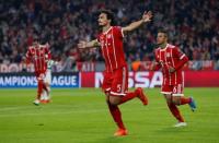 Soccer Football - Champions League - Bayern Munich vs Celtic - Allianz Arena, Munich, Germany - October 18, 2017 Bayern Munich's Mats Hummels celebrates scoring their third goal with Thiago Alcantara REUTERS/Michaela Rehle