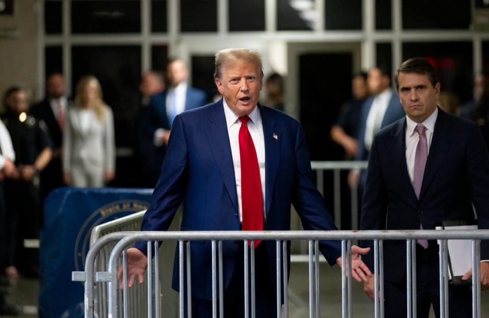 Donald Trump speaks to reporters in criminal court in Manhattan on 30 April (EPA)