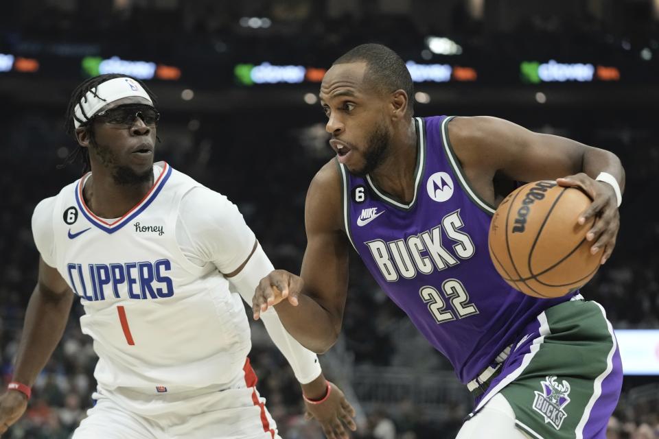 Milwaukee Bucks' Khris Middleton drives past Los Angeles Clippers' Reggie Jackson during the first half of an NBA basketball game Thursday, Feb. 2, 2023, in Milwaukee. (AP Photo/Morry Gash)