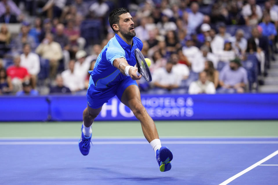 Novak Djokovic, of Serbia, returns a shot to Daniil Medvedev, of Russia, during the men's singles final of the U.S. Open tennis championships, Sunday, Sept. 10, 2023, in New York. (AP Photo/Manu Fernandez)