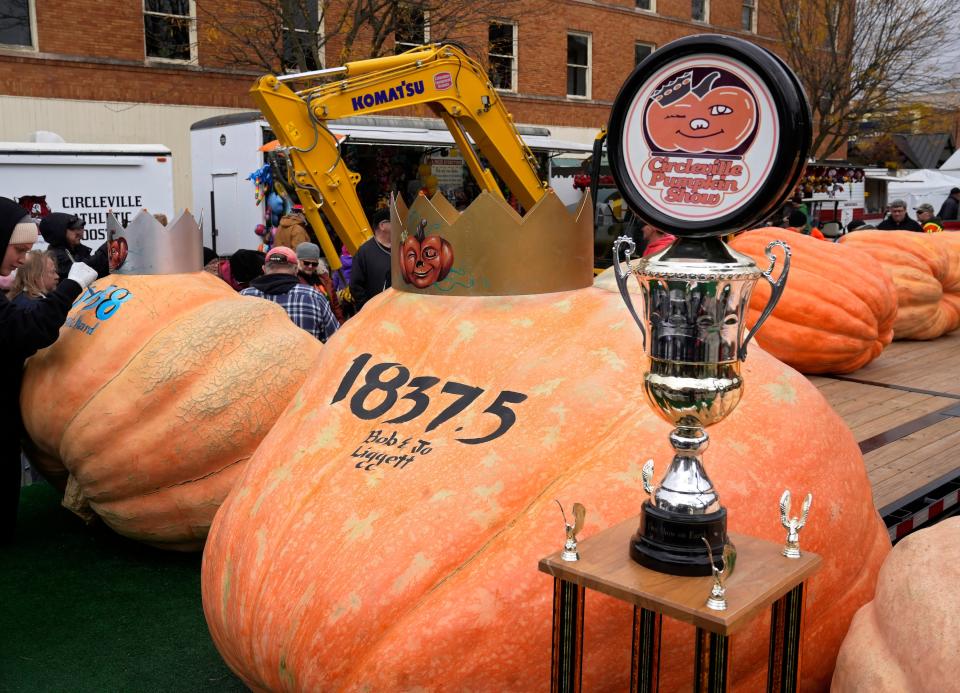 Bob Liggett, of Circleville, took the Grand Champion crown and trophy for his 1,837.5-pound pumpkin at the 2022 Circleville Pumpkin Show. It was his 15th win, and he's returning to compete this year.