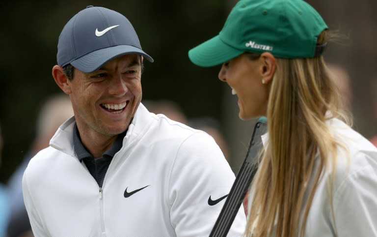 Second-ranked Rory McIlroy of Northern Ireland, left, has reportedly filed for divorce from his wife Erica, right, who is shown with McIlroy at the 2018 Masters Par-3 Contest (Patrick Smith)