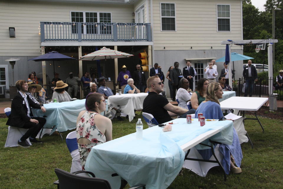 Liz Purvis, the Granville County Democratic Party chair, introduces the slate of candidates present at the party's fundraiser in Oxford, N.C., on Friday, May 10, 2024. About 35 people attended the fundraiser, which was a first for the party in a few years. (AP Photo/Makiya Seminera)