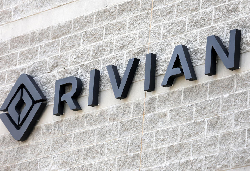 PHOENIX, ARIZONA - OCTOBER 08: The Rivian logo is displayed at a Rivian Service Center on October 8, 2022 in Phoenix, Arizona. The electric vehicle manufacturer is recalling nearly all of the over 12,000 vehicles it had produced to tighten an ‘insufficiently torqued fastener’ which could potentially affect steering. (Photo by Mario Tama/Getty Images)