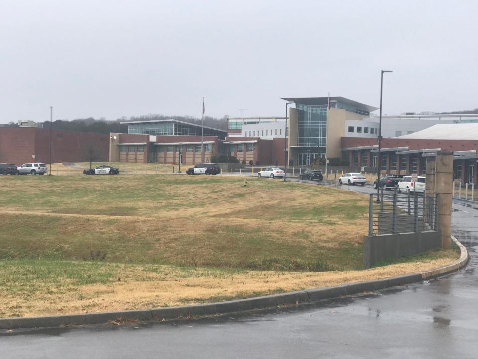 The scene outside Oak Ridge High School shortly after noon Monday, Dec. 6, 2021. Another Oak Ridge Police Department patrol car partially blocked the main entrance to the school. Later two patrol cars completely blocked the entrance.