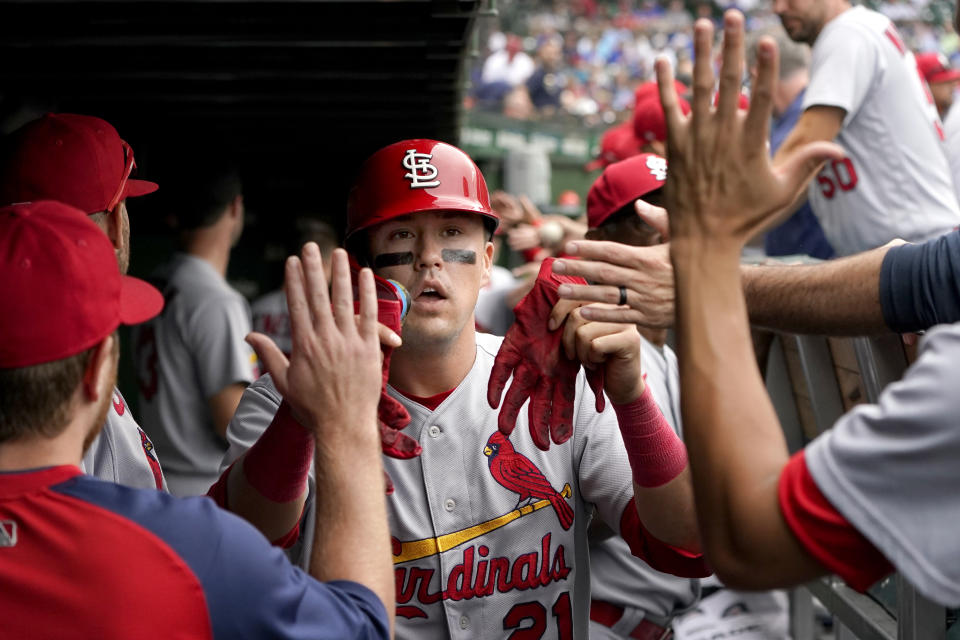 St. Louis Cardinals' Lars Nootbaar celebrates in the dugout after scoring on Paul Goldschmidt's single off Chicago Cubs starting pitcher Marcus Stroman during the fourth inning of a baseball game Thursday, Aug. 25, 2022, in Chicago. (AP Photo/Charles Rex Arbogast)