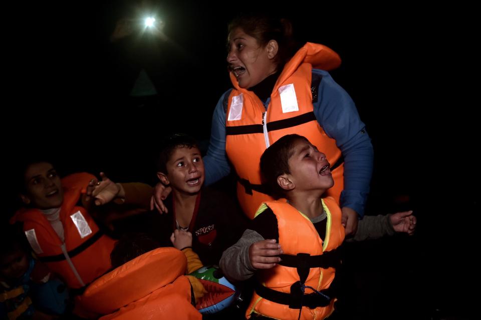 Refugees and migrants arrive at Lesbos island after crossing the Aegean sea from Turkey on October 27, 2015.&nbsp;