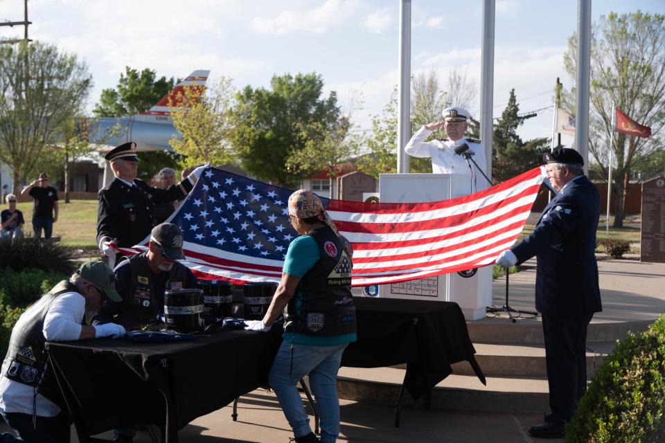 A U.S. flag is prepared for presentation to Judge Nancy Tanner Wednesday evening during the Missing in America's Project ceremony honoring three unclaimed veterans at the Texas Panhandle War Memorial Center in Amarillo.