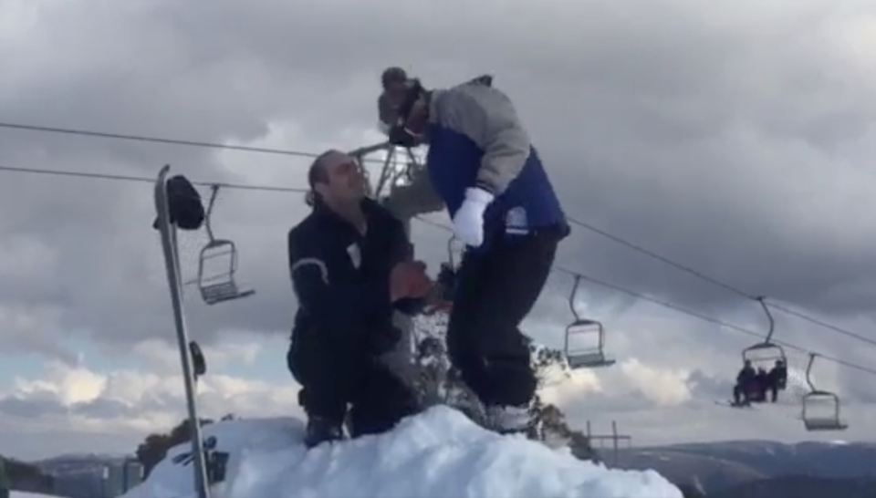 A man proposes to his partner at Selwyn Snow Resort before it was devastated by bushfires.