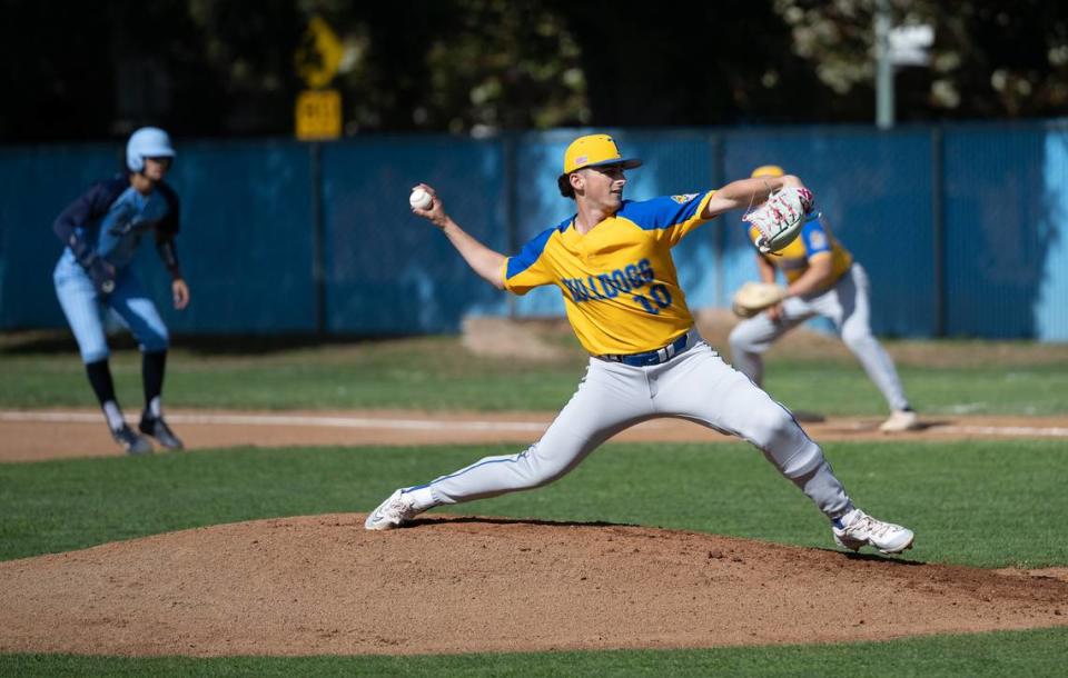 Turlock’s Mason Baker delivers a pitch to a Downey batter during the Central California Athletic League game at Downey High School in Modesto, Calif., Friday, April 12, 2024. Turlock won the game 3-2.