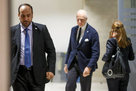 Nasr al-Hariri, left, Head of the Syrian Negotiation Commission, and UN Special Envoy to the Secretary-General for Syria Staffan de Mistura arrive for a round of negotiation during the Intra Syria talks at the European headquarters of the United Nations in Geneva, Switzerland December 13, 2017. REUTERS/Salvatore Di Nolfi/Pool
