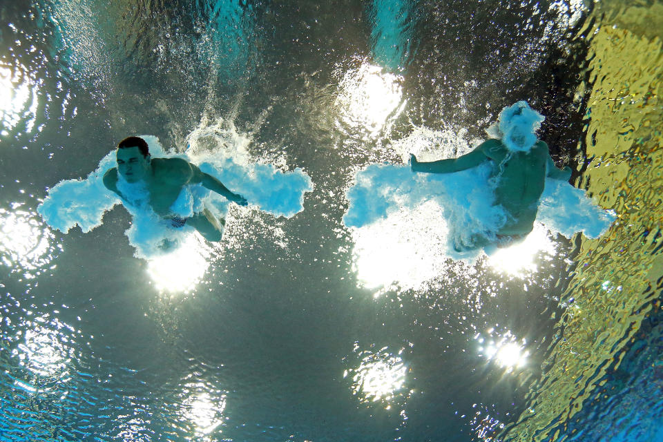 LONDON, ENGLAND - AUGUST 01: (L-R) Troy Dumais and Kristian Ipsen of the United States compete in the Men's Synchronised 3m Springboard Diving on Day 5 of the London 2012 Olympic Games at the Aquatics Centre on August 1, 2012 in London, England. (Photo by Clive Rose/Getty Images)