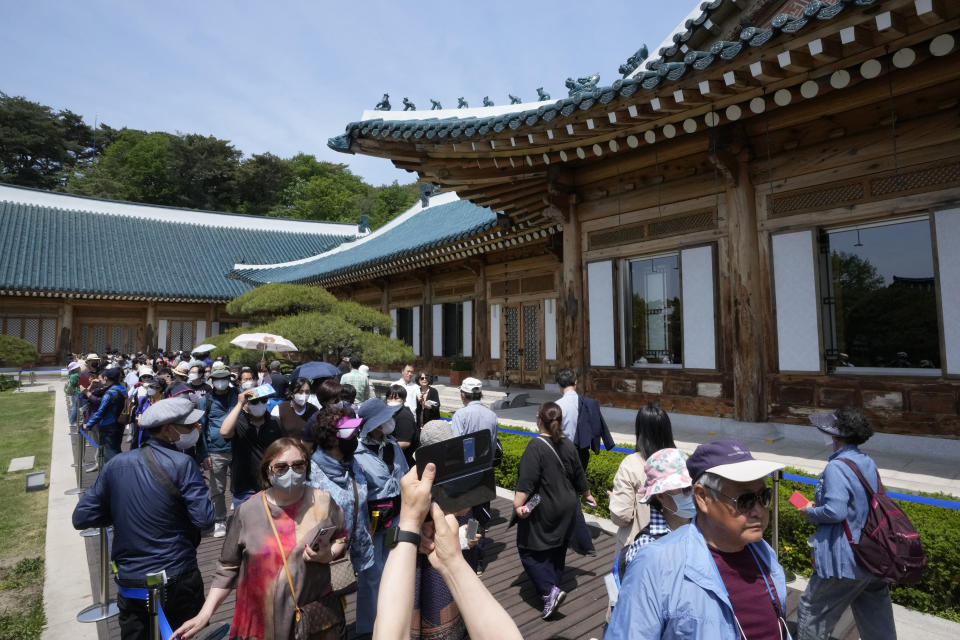 People visit the Blue House, the former presidential palace, in Seoul, South Korea, Thursday, May 12, 2022. For most South Koreans, the former presidential palace in Seoul was as shrouded in mystery as the buildings in their secretive rival North Korea. That’s now changed recently as thousands have been allowed a look inside for the first time in 74 years. (AP Photo/Ahn Young-joon)