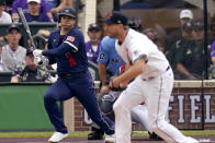 American League's Shohei Ohtani, of the Los Angeles Angeles, grounds out on a pitch by National League's starting pitcher Max Scherzer, of the Washington Nationals, during the first inning of the MLB All-Star baseball game, Tuesday, July 13, 2021, in Denver. (AP Photo/Gabriel Christus)