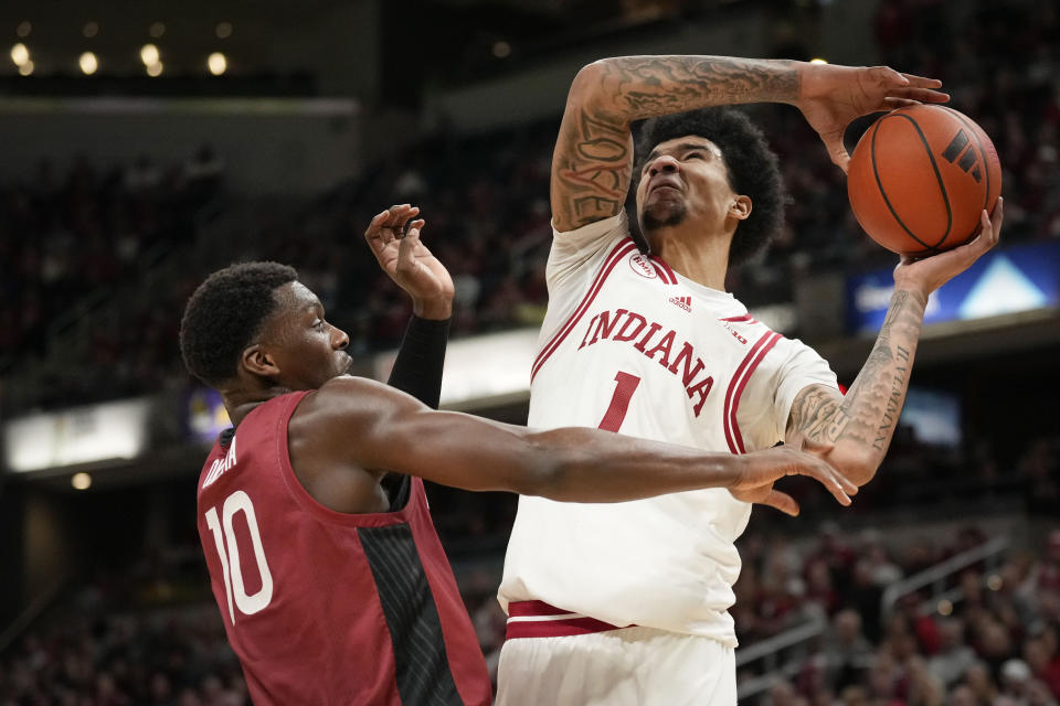 Indiana center Kel'el Ware (1) shoots over Harvard forward Chisom Okpara (10) in the second half of an NCAA college basketball game in Indianapolis, Sunday, Nov. 26, 2023. (AP Photo/AJ Mast)