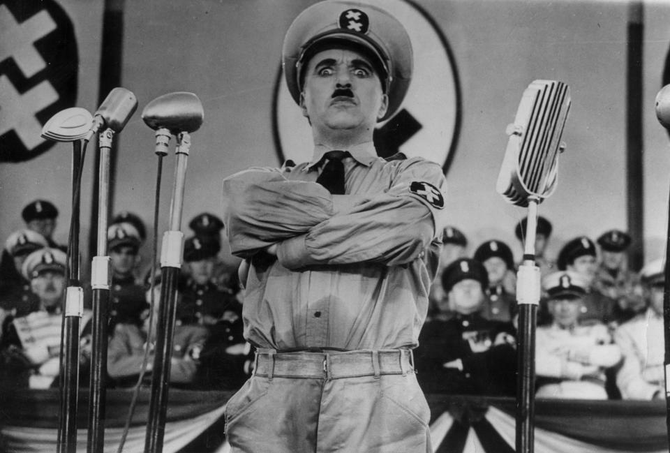 English actor Charlie Chaplin (1889 - 1977) directs and stars in the film 'The Great Dictator'.   (Photo by Hulton Archive/Getty Images)